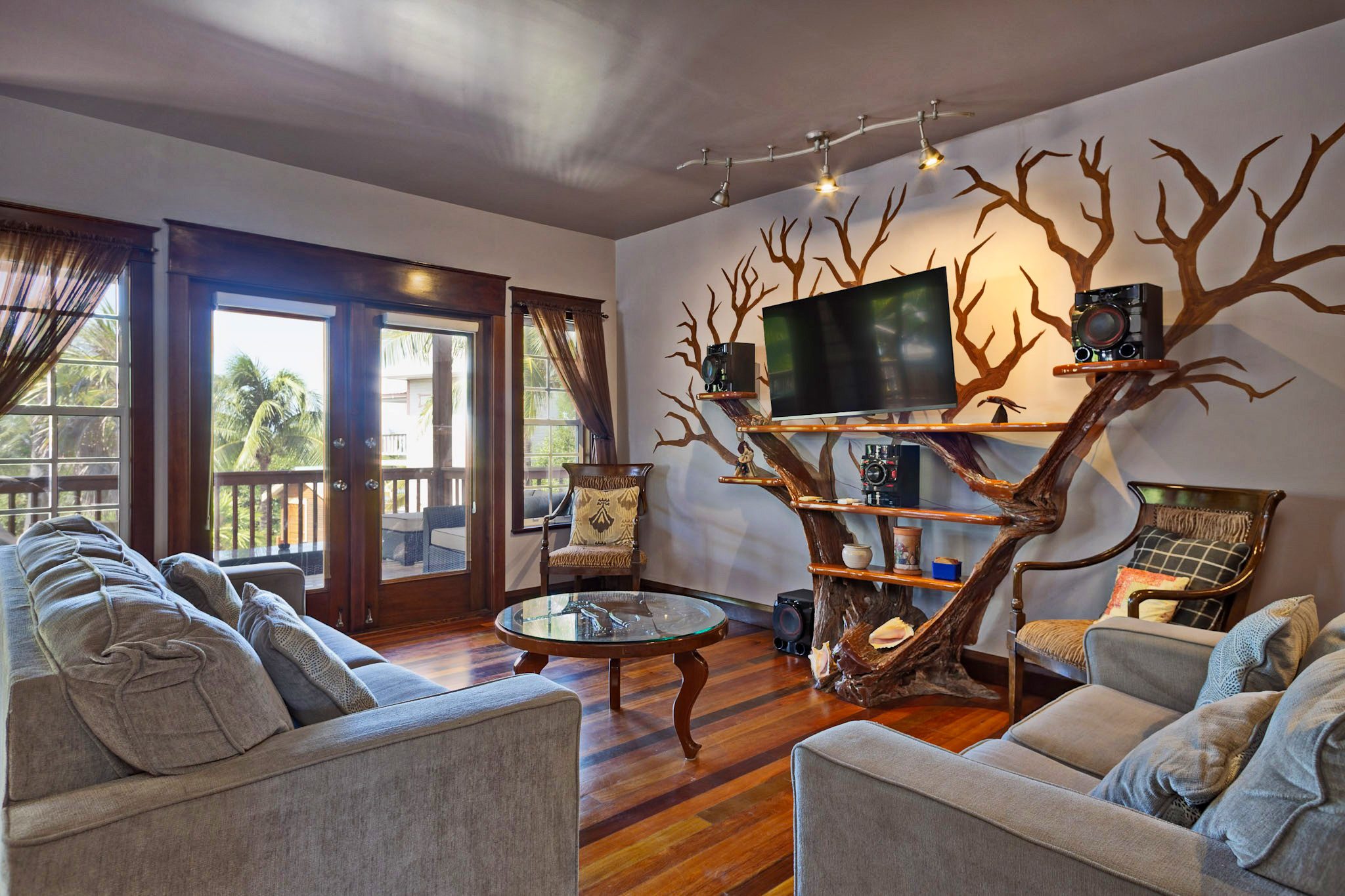 Living room with tree branch decor.