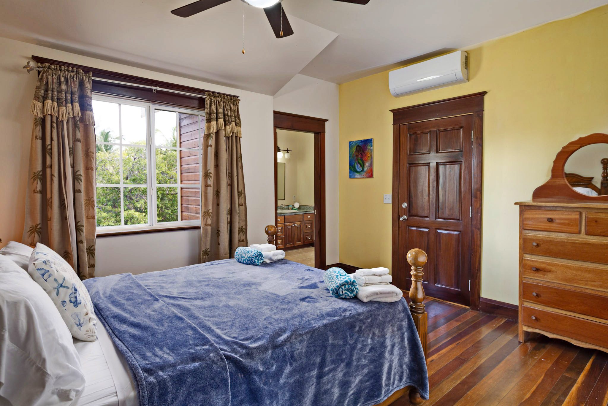 Cozy bedroom with wooden furniture and decor.