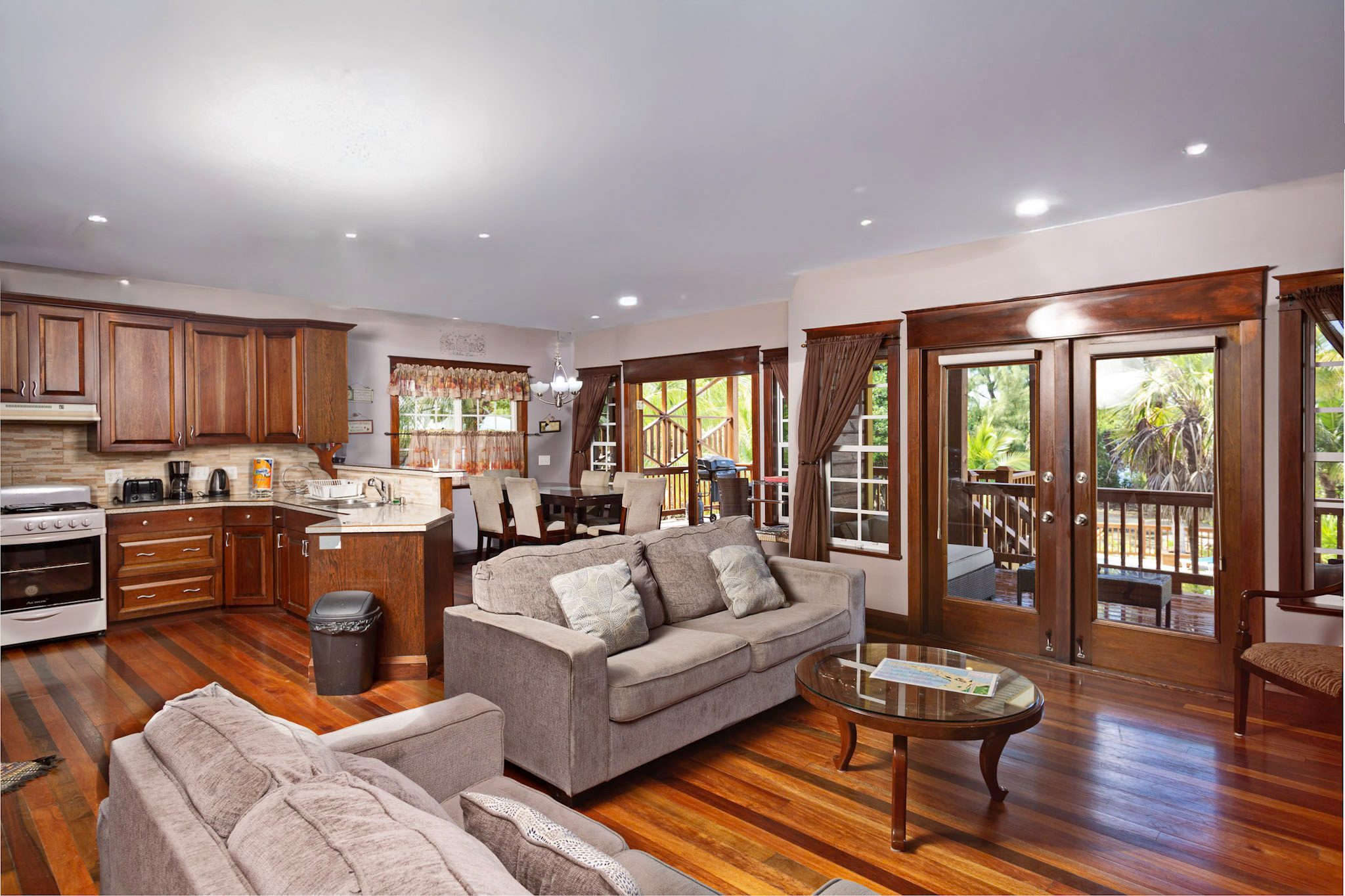 Open-plan living room with wooden flooring.