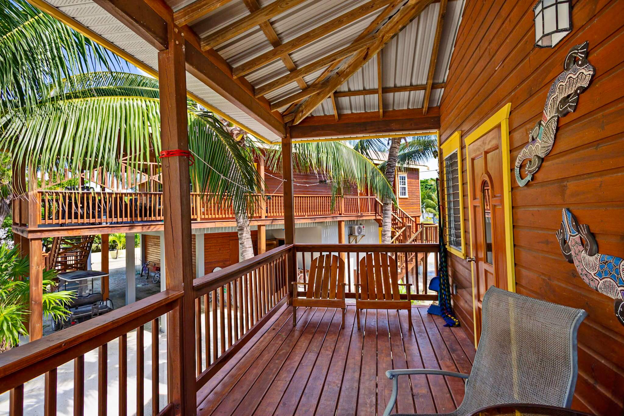 Wooden porch with tropical view and decorations.