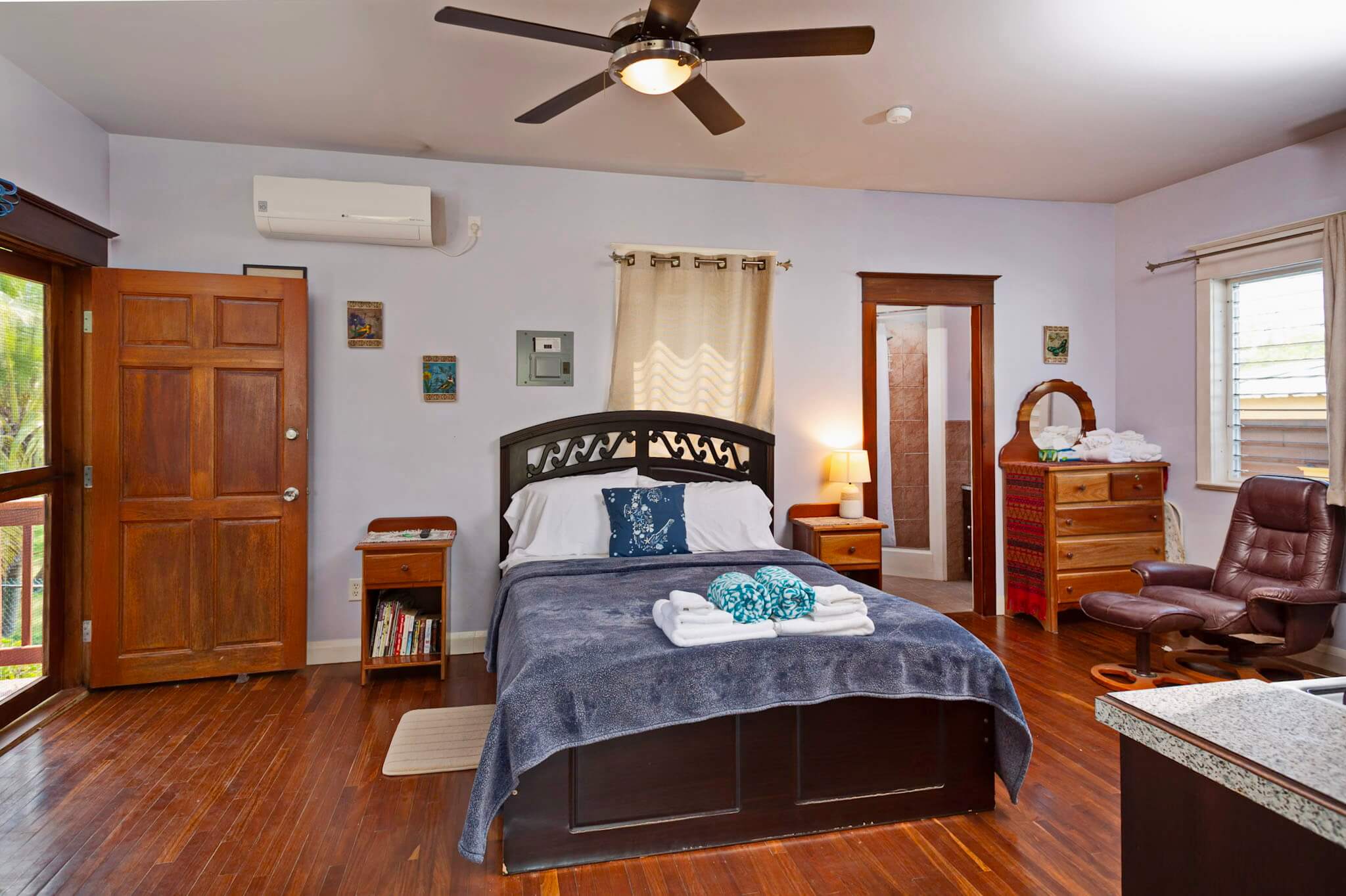 Cozy bedroom with wooden furniture and decor.