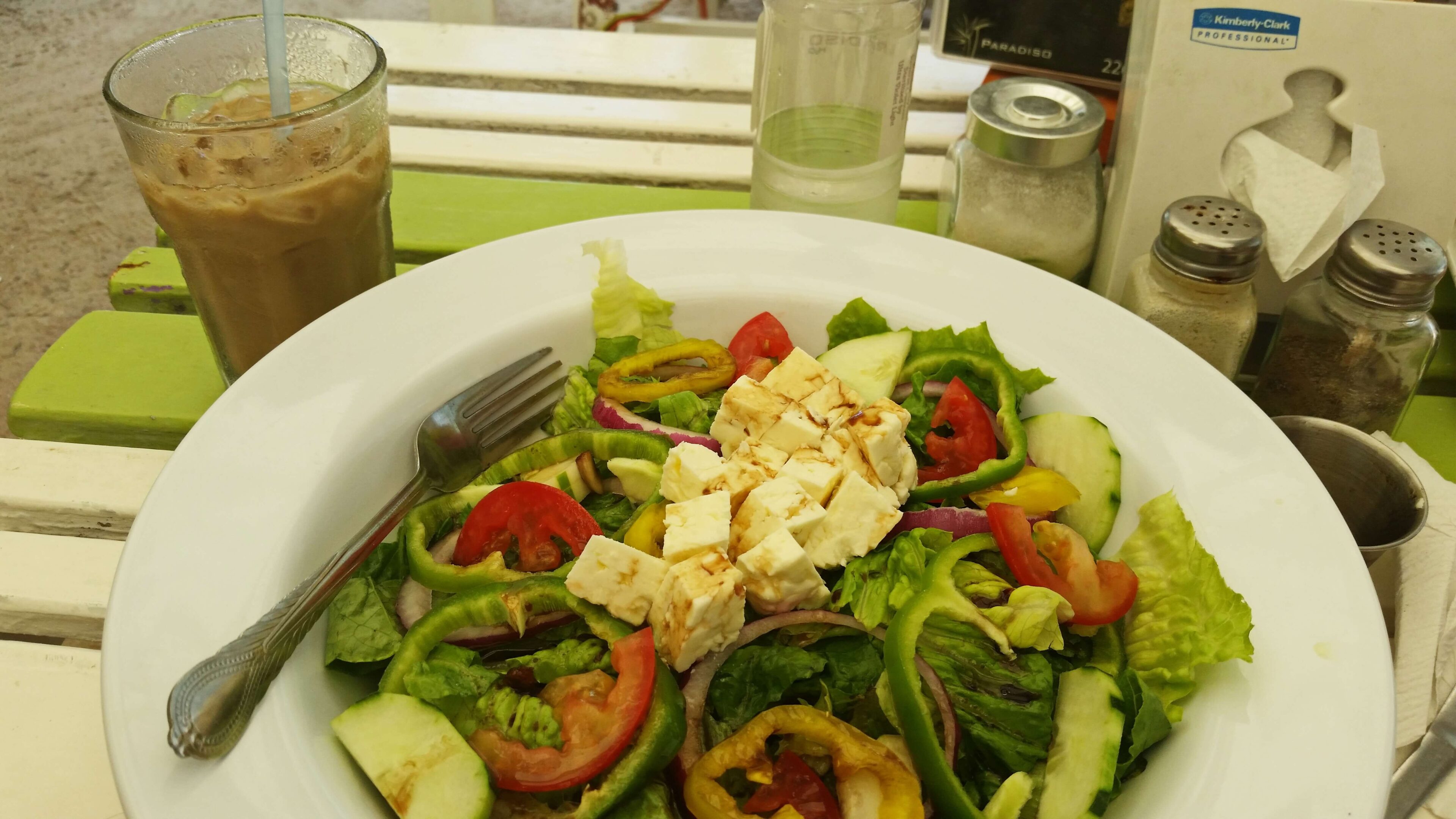 Salad with feta cheese and iced coffee.