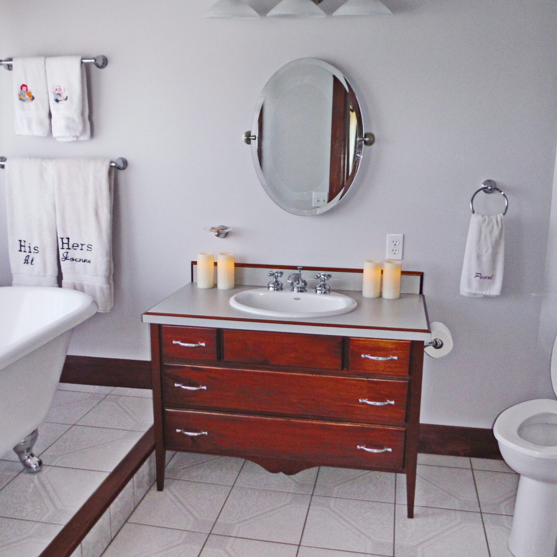 Elegant bathroom with vintage-style wooden vanity.